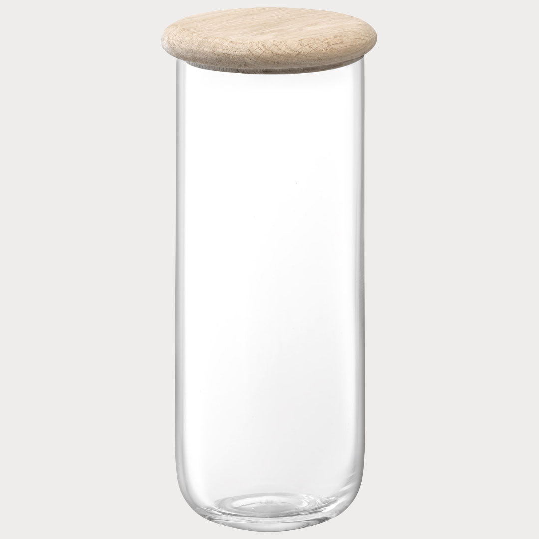 side profile of the tall glass container showcasing its sleek design