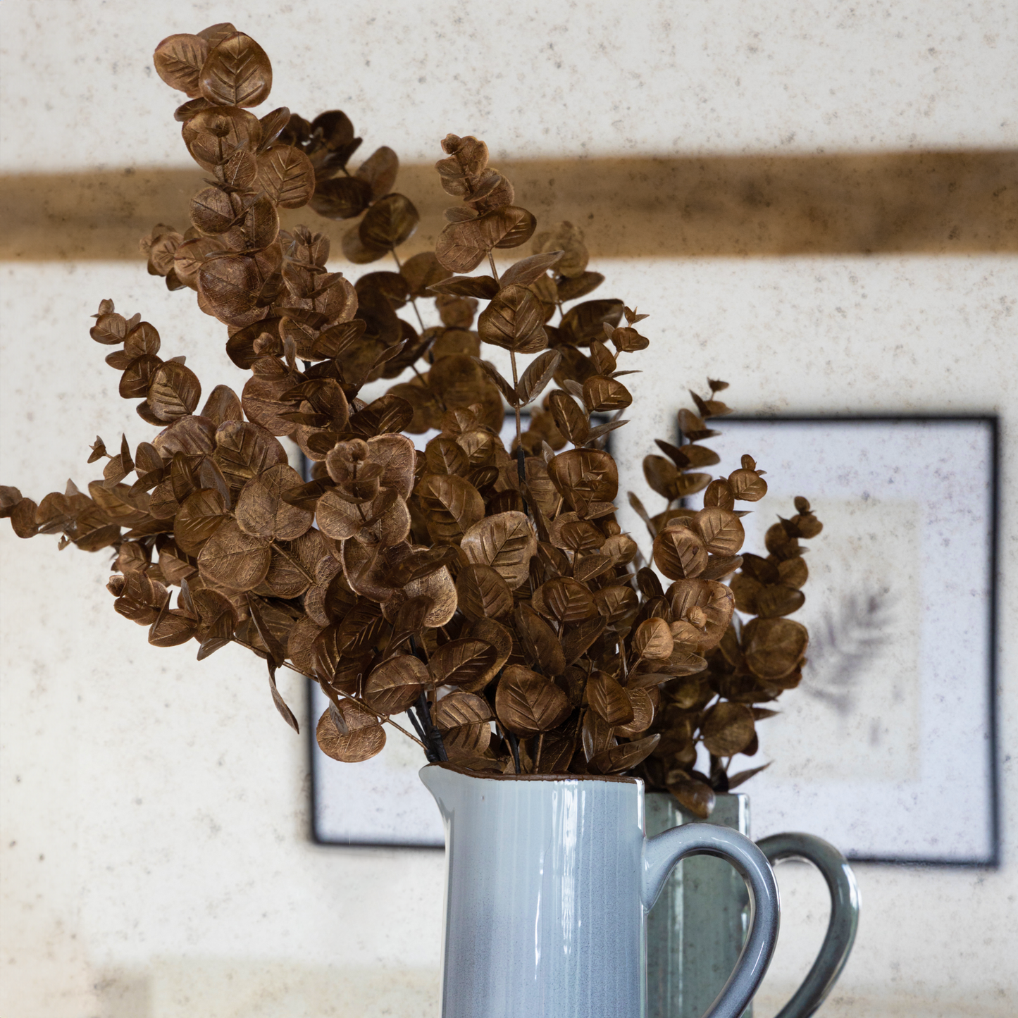 Metallic Eucalyptus Leaves Stem with rich warm tones and metallic accents, available at Clarkson Lee Lifestyle.