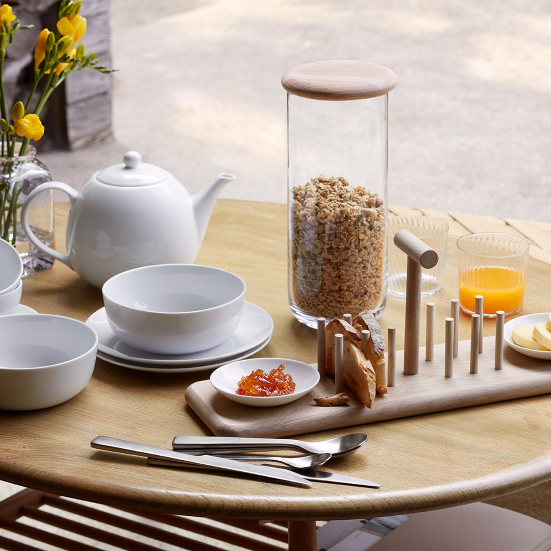 Set of Glass & Oak Storage Containers in various sizes displayed on a kitchen shelf.
