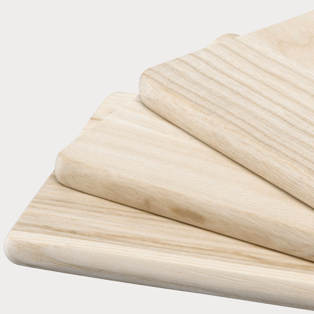 Close-up of Wooden Serving Board highlighting the leather handle and wood grain.