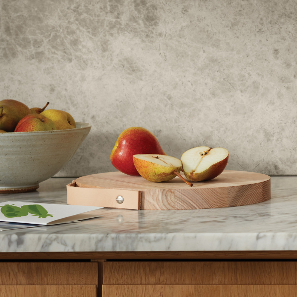 Wooden Board used as a serving platter with assorted fruits.