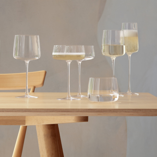 Champagne saucers filled with cocktails, capturing the festive ambiance.