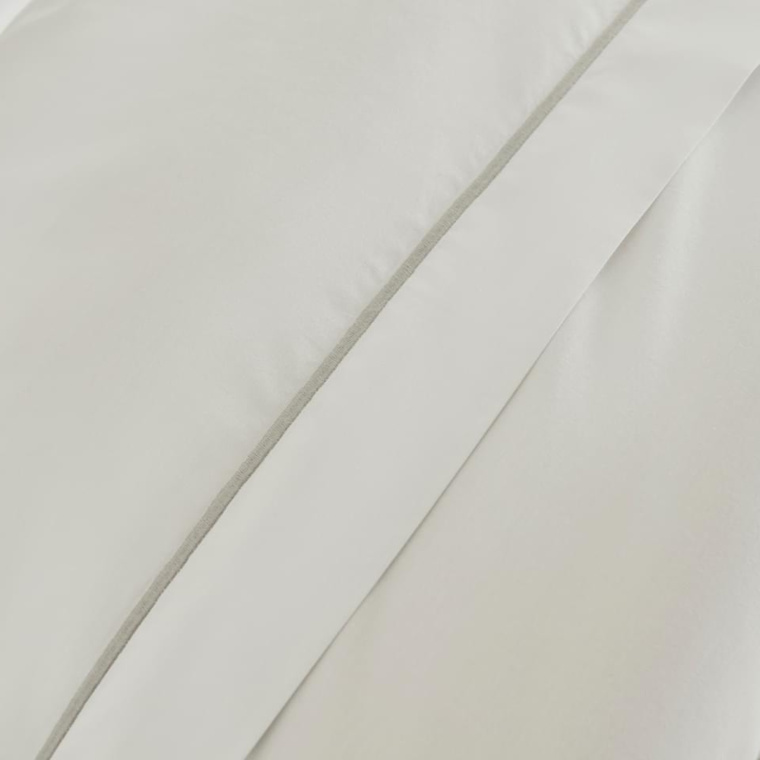 Close-up of the triple cord detail on the Pure Cotton Bedding Set in White and Silver.