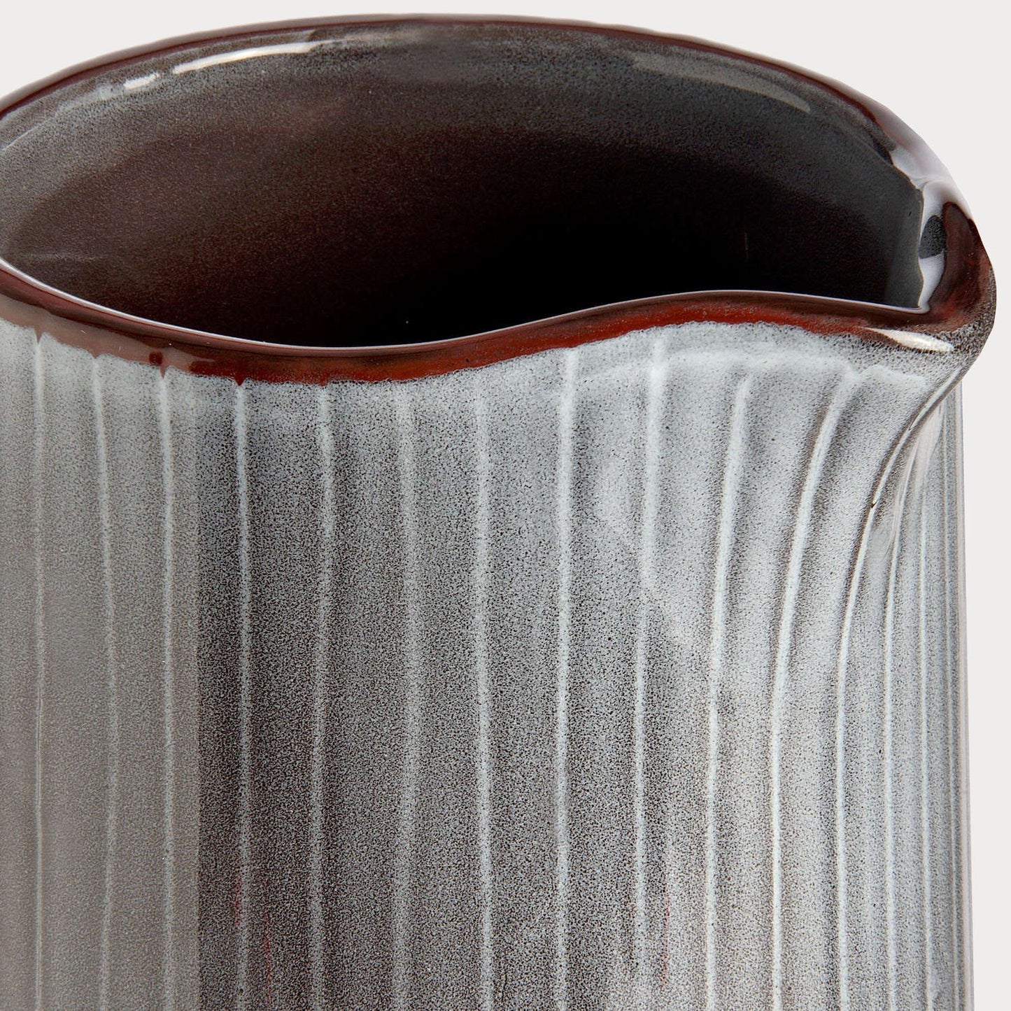Side profile of Display Jug highlighting its elegant handle and spout design.