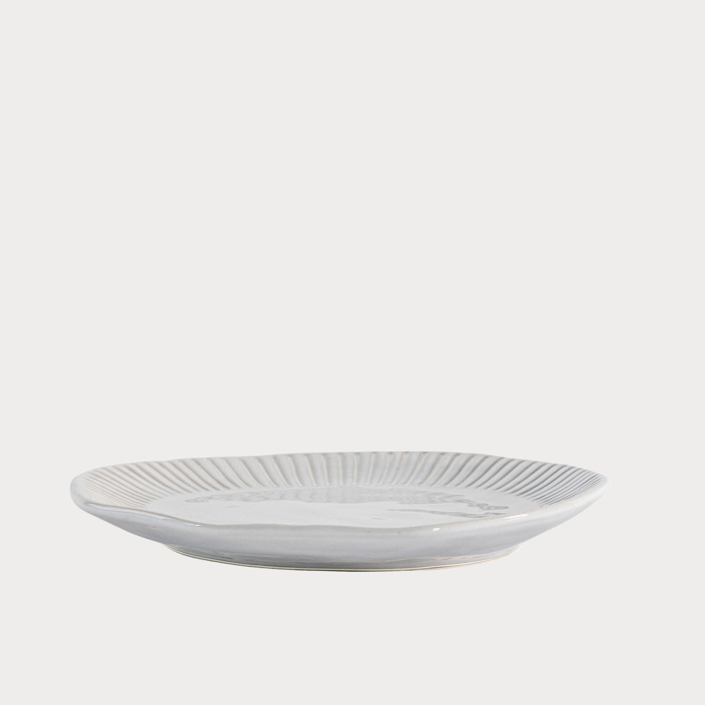 Set of Organic Ridged Side Plates neatly stacked, highlighting their uniform craftsmanship.