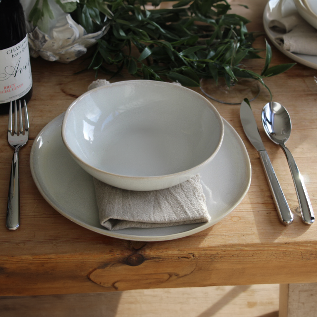 Set of Organic Shaped Side Plates neatly stacked, highlighting their uniform craftsmanship.