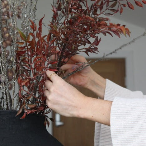 Autumnal Leaf Spray arranged in a vase, adding seasonal charm to interior décor.