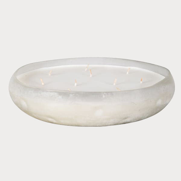 Close-up of Sea Salt Scented Candle's smooth wax surface in a stylish glass container.