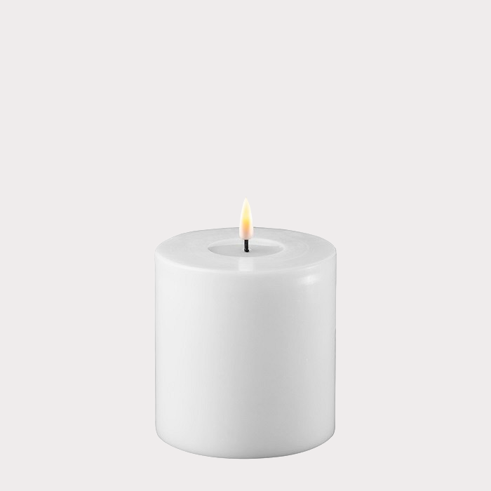 Wide White Indoor LED Candle displayed on a decorative tray with other home accessories.