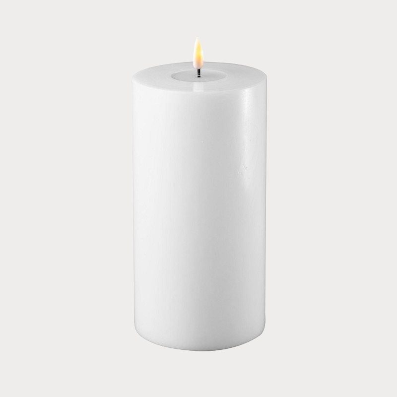 Wide White Indoor LED Candle illuminating a modern living room setting
