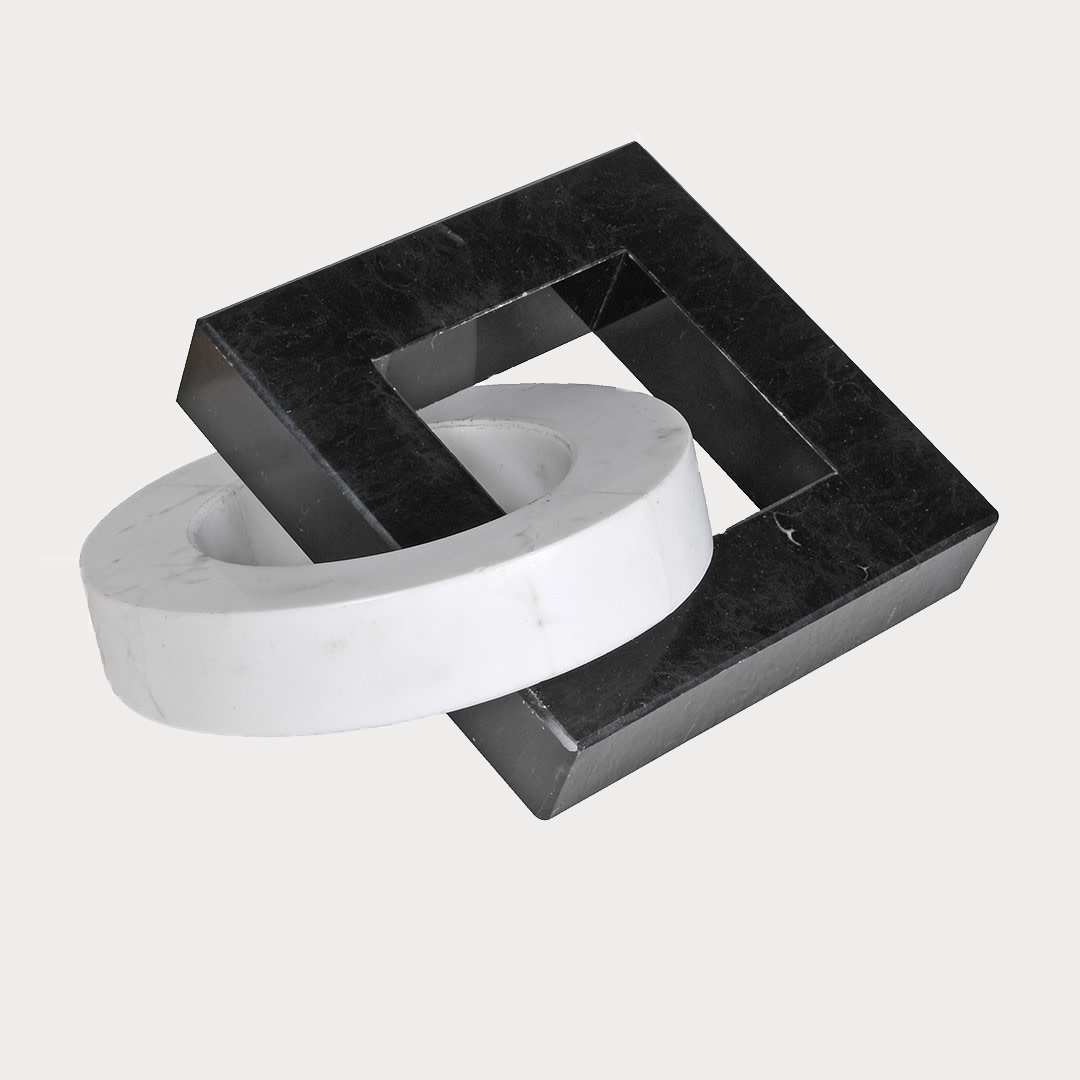 Close-up of Interlocked Marble Sculpture highlighting the unique veining patterns of the black and white marble.