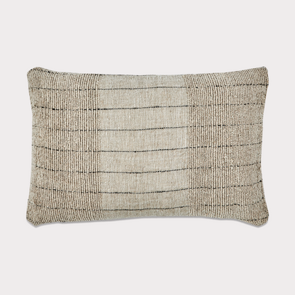 Side view of the cushion highlighting its natural fabric blend and craftsmanship.
