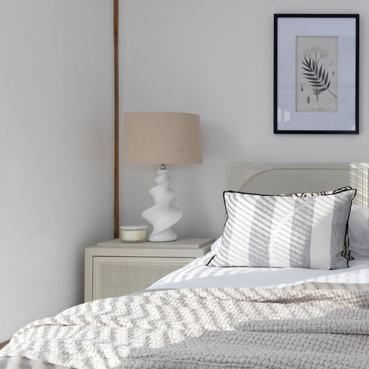 Swirl Table Lamp with Shade featuring a white ceramic base with delicate swirl design, available at Clarkson Lee Lifestyle.