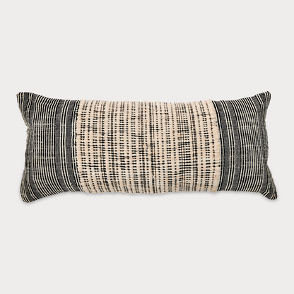 Side view of the cushion highlighting its neutral tones and sustainable craftsmanship.
