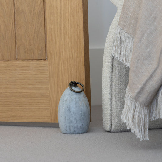Grey Marble & Brass Door Stop featuring a sleek design with natural grey marble and brass handle, available at Clarkson Lee Lifestyle.