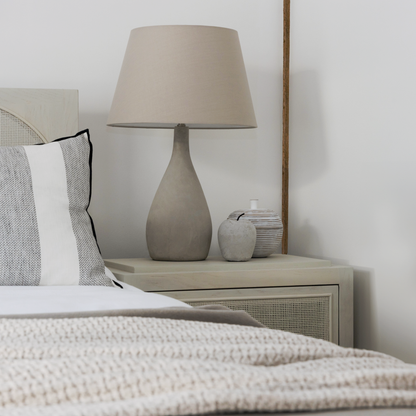 Cement Apple Ornament displayed on a shelf, adding a contemporary touch to the décor.

