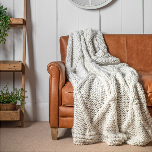 Knitted Diamond Throw in a classic diamond pattern, available in Olive and Cream at Clarkson Lee Lifestyle.