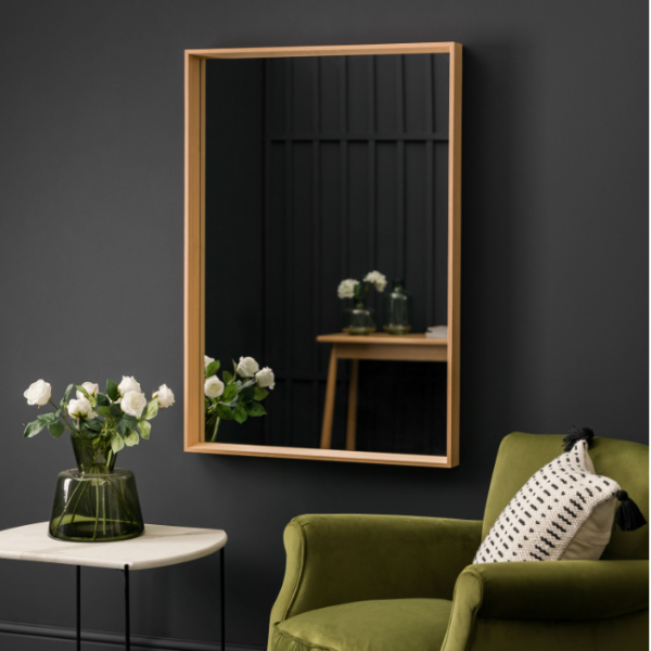 Oak Wall Mirror hung in a modern living room, complementing contemporary decor.