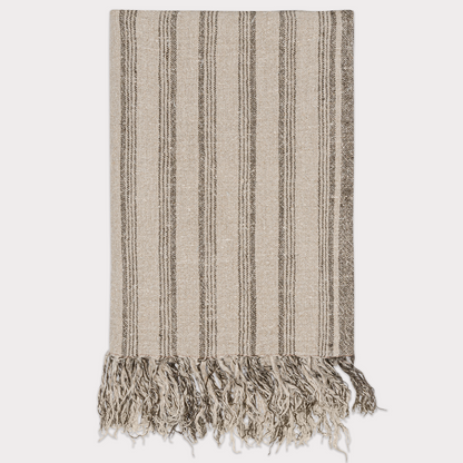 Close-up of the Striped Linen Throw showcasing its handwoven texture and neutral color palette.