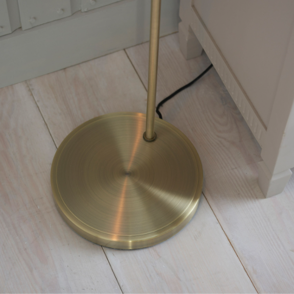 base of the brass lamp showcasing its sleek design