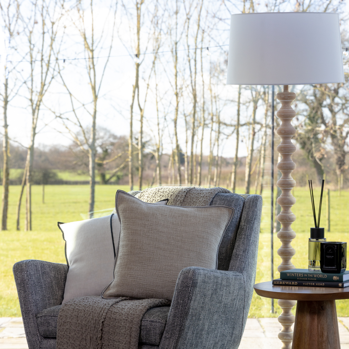 Tall Floor Lamp with natural wood base and linen shade, available at Clarkson Lee Lifestyle.