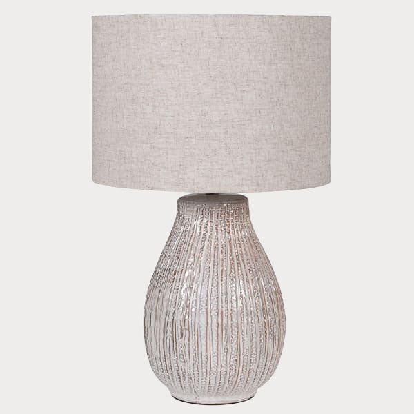 Close-up of the Textured Table Lamp's base showcasing its intricate texture and craftsmanship.