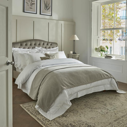 Luxurious Textured Velvet Throw in a neutral putty shade, available at Clarkson Lee Lifestyle.