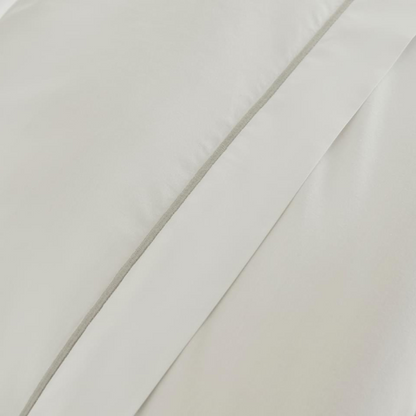 Close-up of the triple cord detail on the Pure Cotton Bedding Set in White and Silver.
