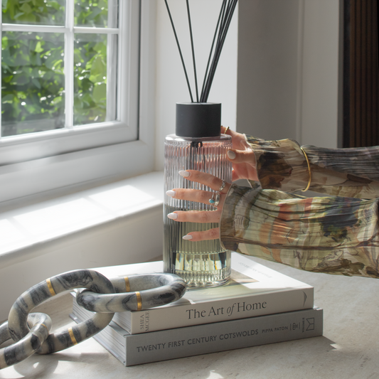 Moroccan Amber Reed Diffuser with elegant glass bottle and reeds, available at Clarkson Lee Lifestyle.