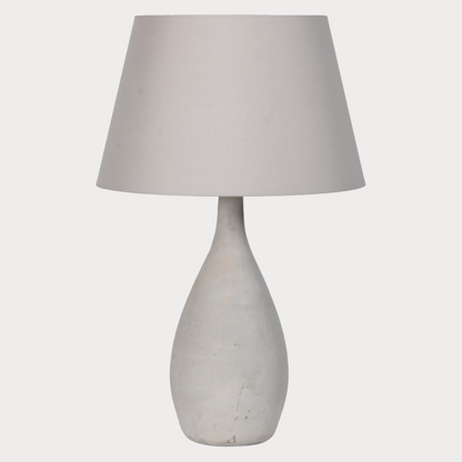 Close-up of the Concrete Lamp's base showcasing its industrial-inspired texture.