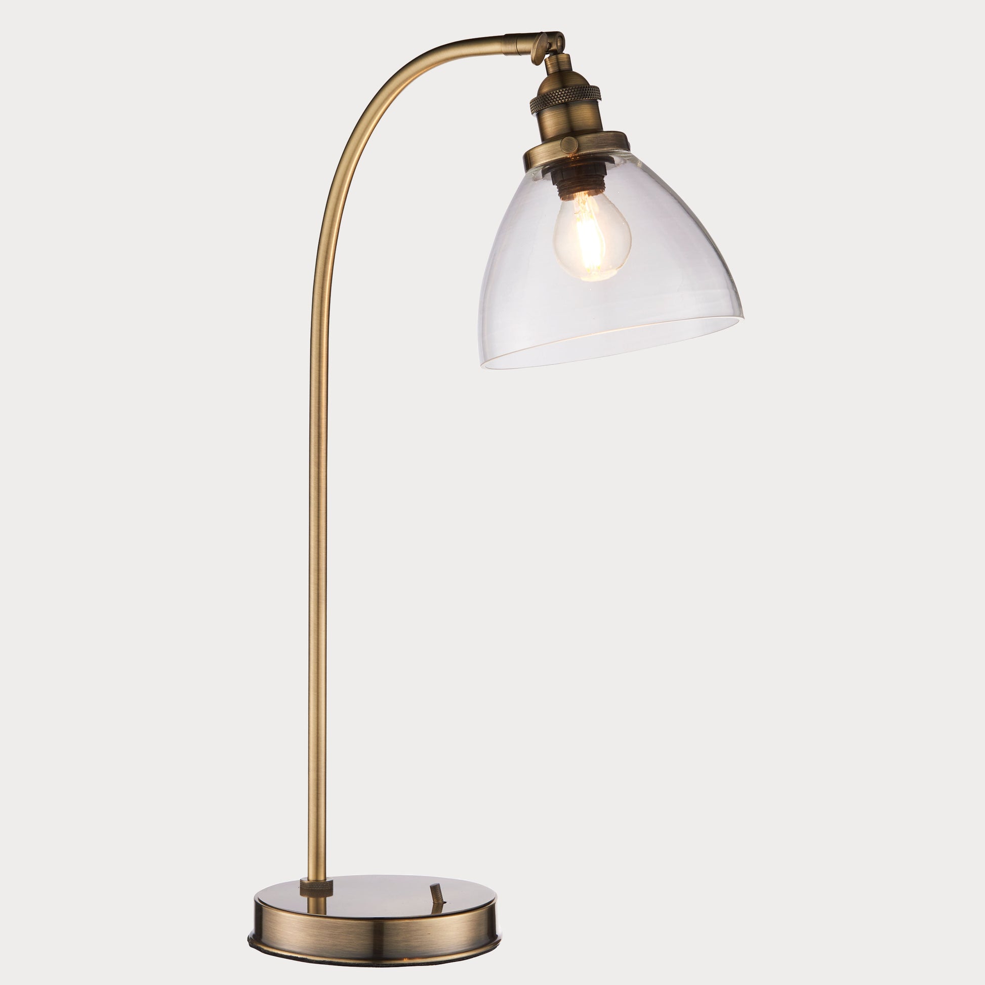 Close-up of the Antique Brass Floor Lamp highlighting its sleek design and brass finish.