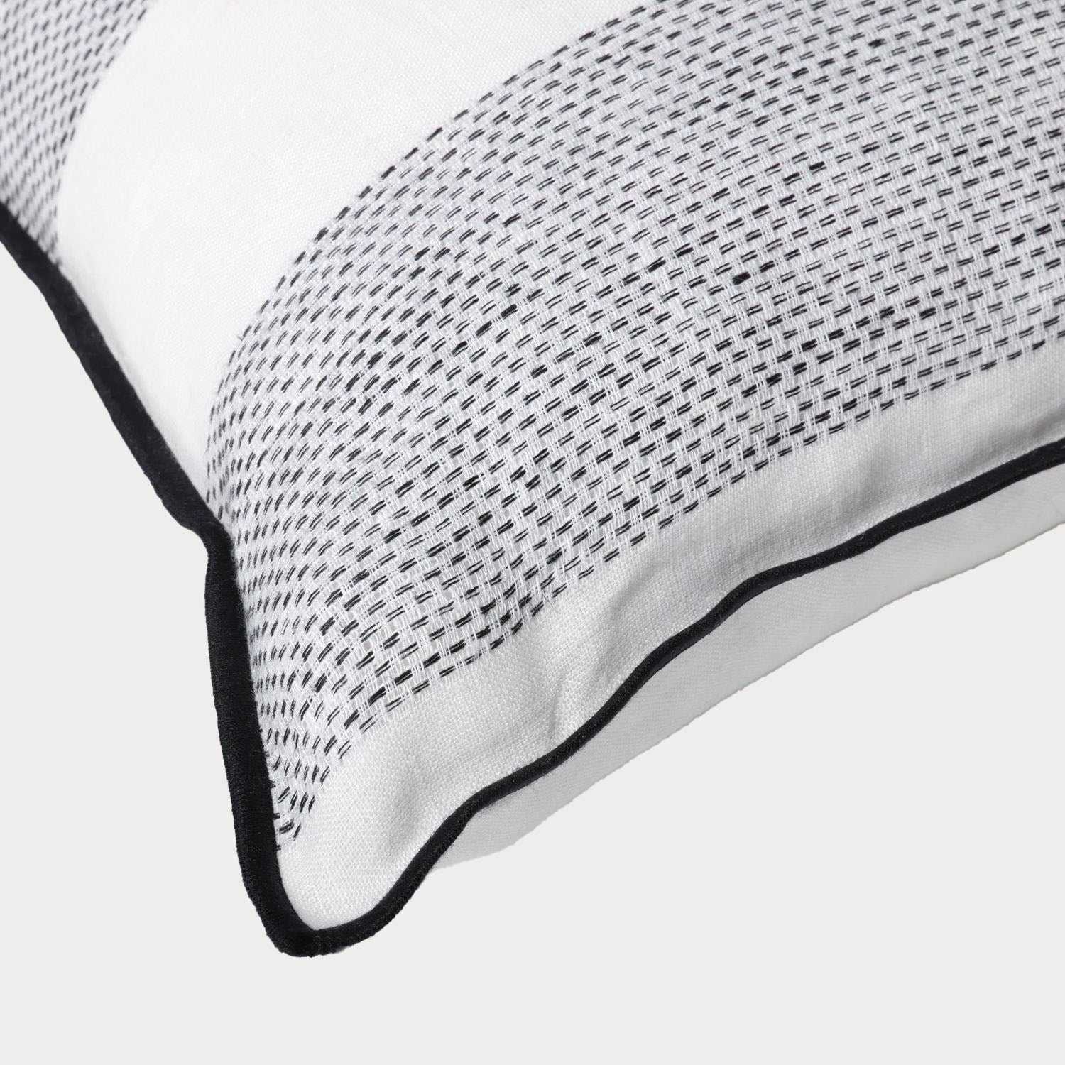 close of of the corner of the linen cushion showcasing its high quality craftsmanship