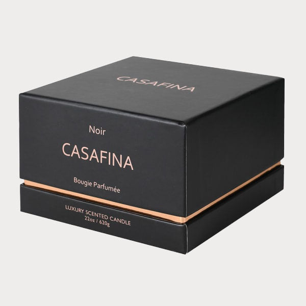 Rose Oud black glass candle placed next to its elegant gift box, ready for gifting.