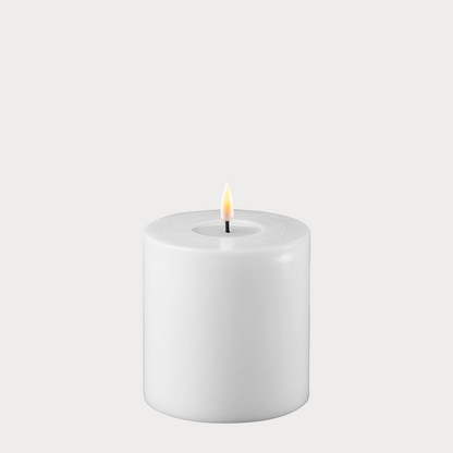Wide White Indoor LED Candle displayed on a decorative tray with other home accessories.