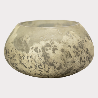 Soy wax candle with smoky quartz crystals lit, creating a warm glow.