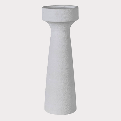 Plaster Effect Candle Holder placed on a mantelpiece, enhancing home decor.
