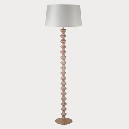 Close-up of the wooden base of the Tall Floor Lamp highlighting its natural grain.