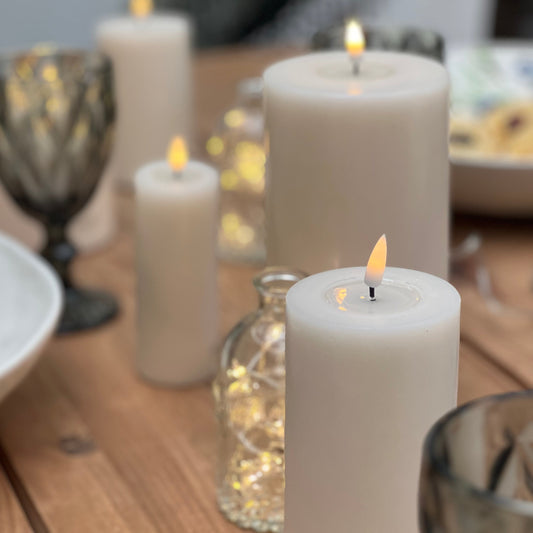 Slim White Indoor LED Candle with realistic flame effect from Clarkson Lee Lifestyle.